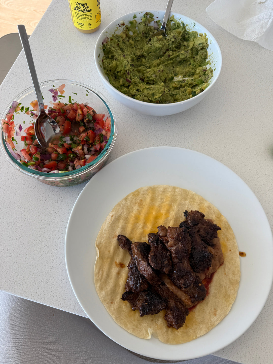Australian skirt steak taco with guacamole and salsa