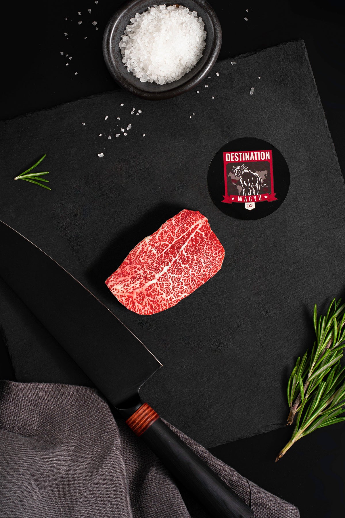 Japanese A5 Miyazaki Wagyu Petite Filet, 4 oz, on a black slate board
