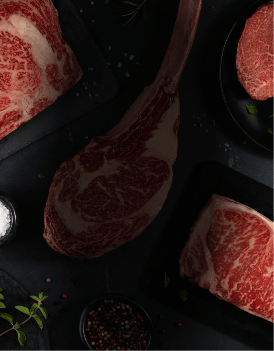 Variety of Wagyu cuts with black pepper and white salt.